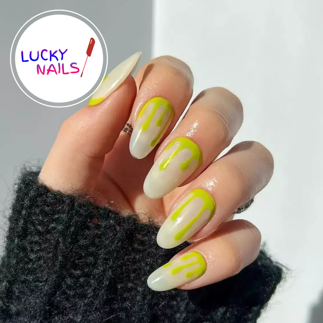 Long milky almond nails with neon-yellow drip design