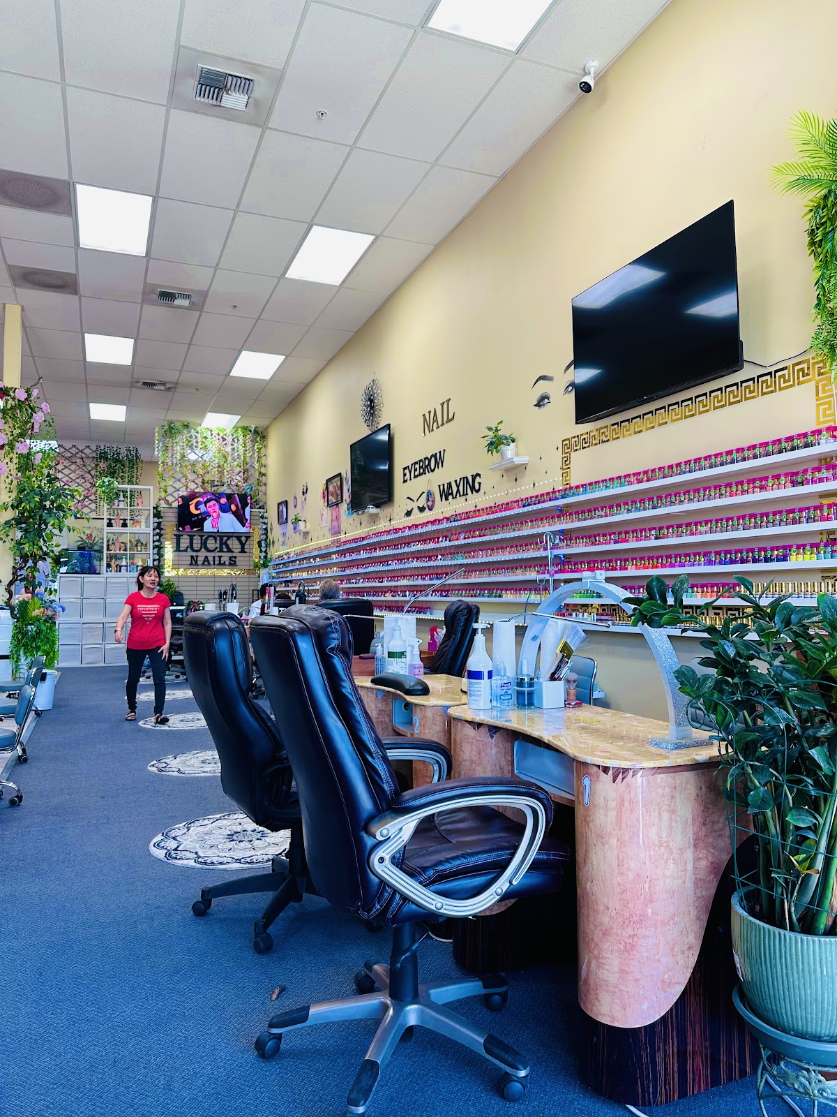 Inside Lucky Nails, Yakima, with the polish wall and manicure stations